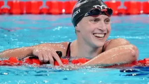 Katie Ledecky sets new Olympic record with 1500m freestyle gold, earning her eighth career gold and tying for most medals.