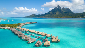 Bora Bora is an enchanting island group in the Leeward Islands of French Polynesia, known for its breathtaking lagoon and barrier reef. Covering 30.55 km², the main island features two peaks from an extinct volcano, Mount Pahia and Mount Otemanu, reaching 727 meters.